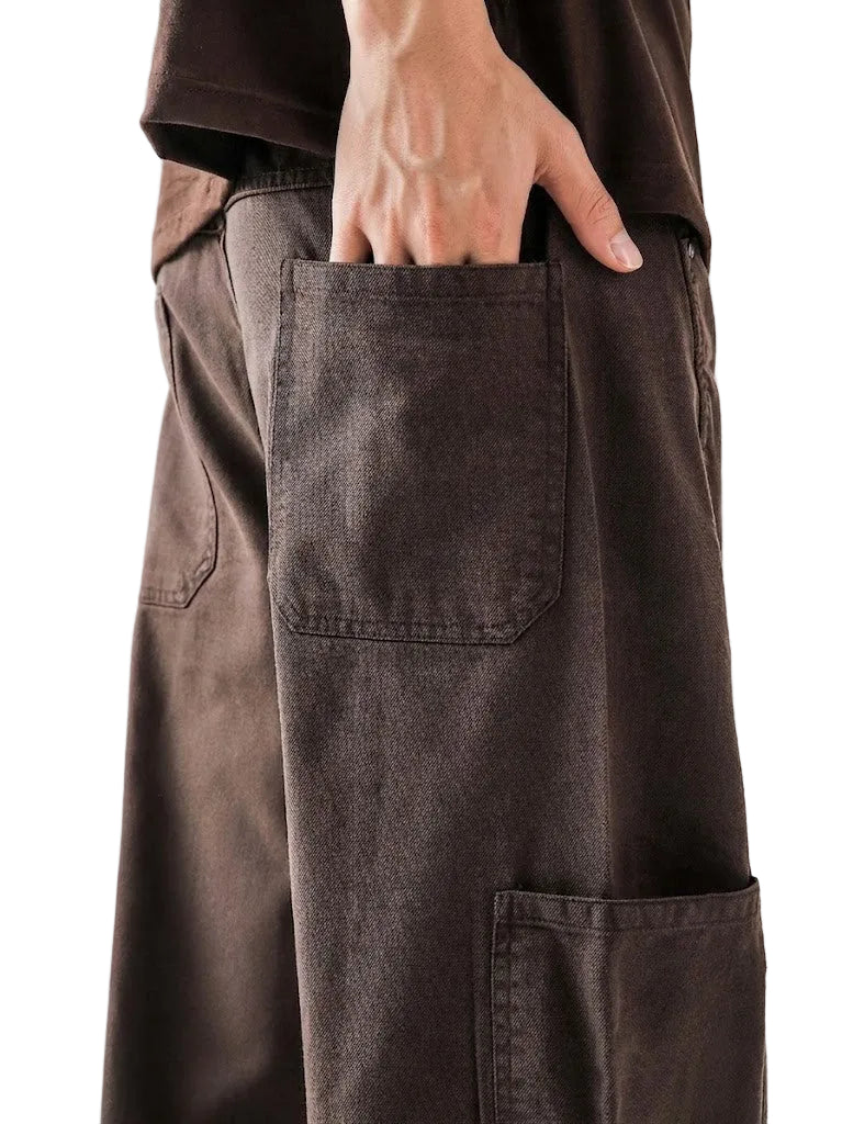 Brown pants with a pocket on a plain background