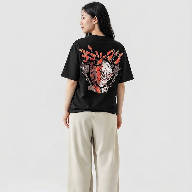 Person wearing a black t-shirt with a graphic design on a white background