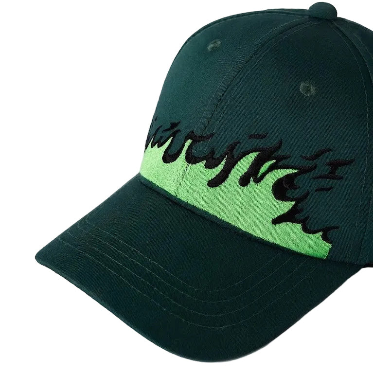 Green and black cap with flame design on a white background