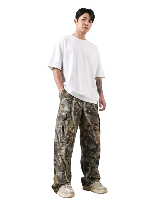 Person wearing a white t-shirt and camouflage pants on a plain background