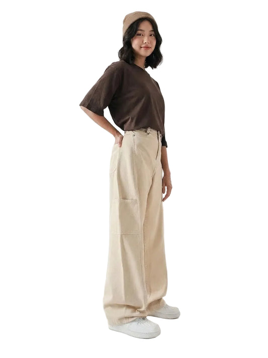 Person wearing a brown shirt, beige pants, and a beige cap on a white background